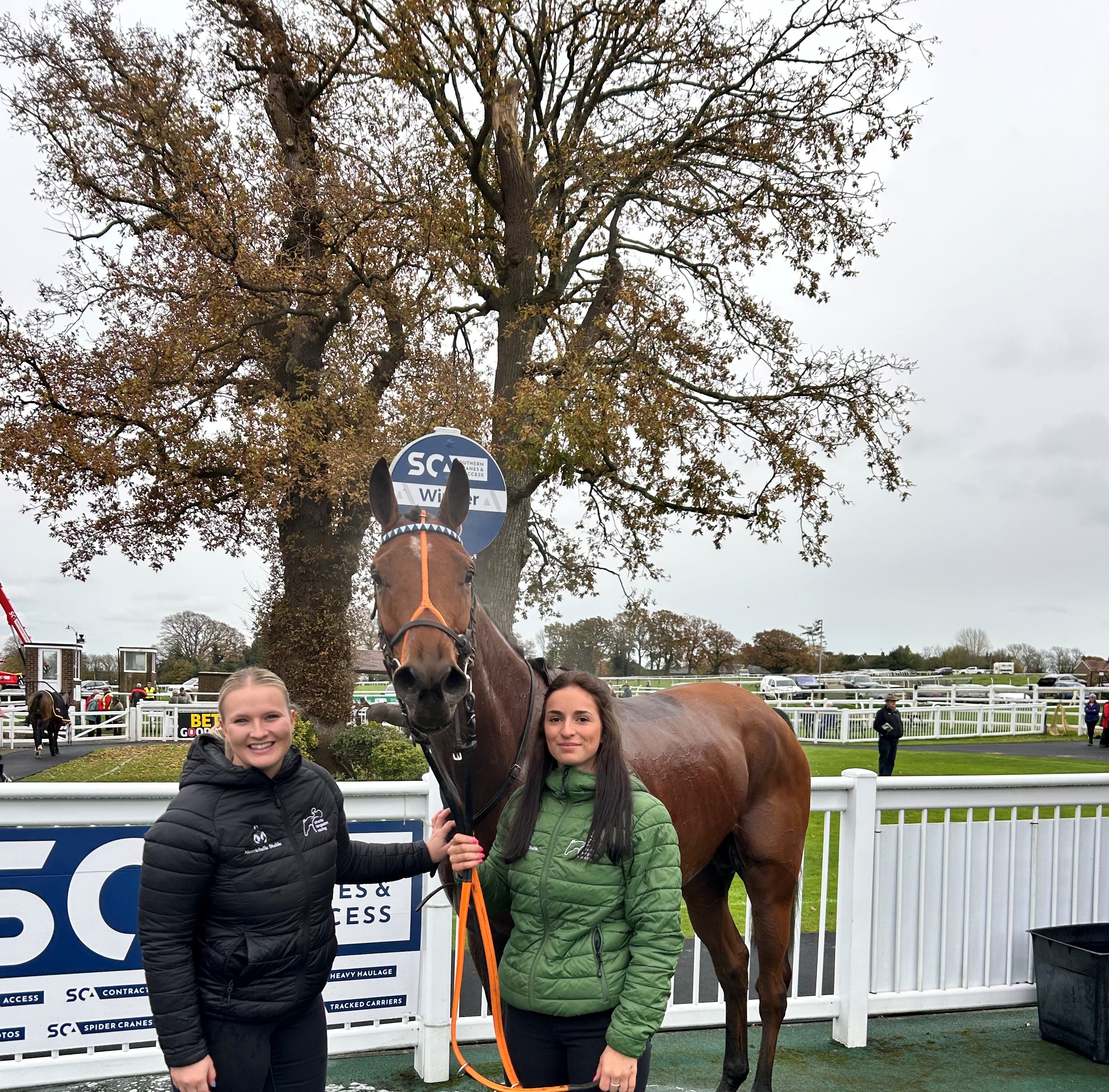 Sign Again in the winner's enclosure with Hannah - her first winner! 